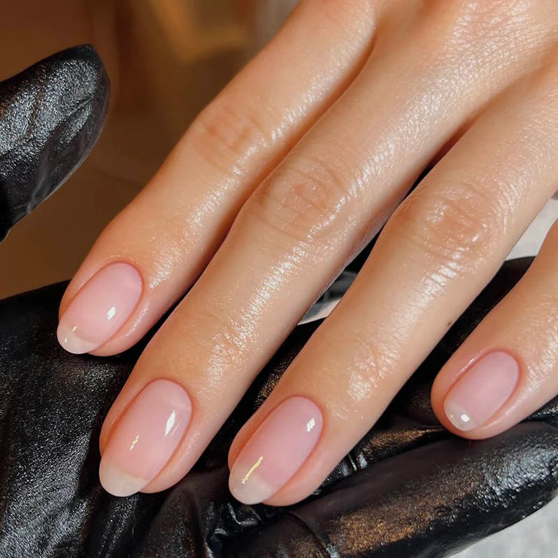 Hand wearing Bio Sculpture Gemini Nail Polish No. 68 French Rose – vegan, natural creamy pink polish for inclusive, sophisticated manicures