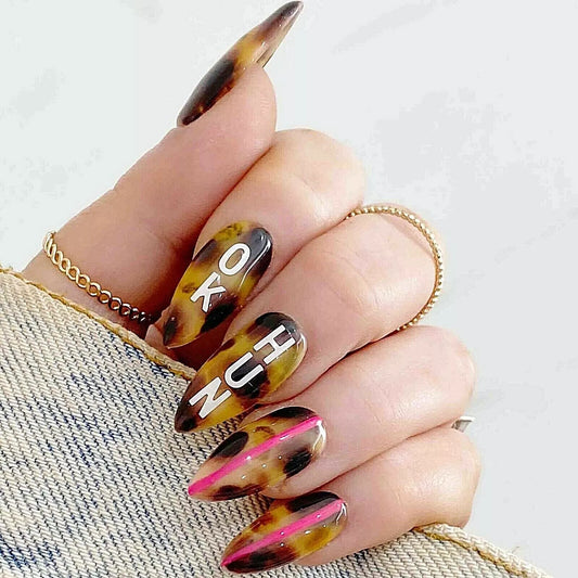 Hand showcasing Bio Sculpture Essence Glitter Love Letters Nail Art Set – sparkling glitter set for stylish, creative nails